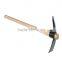 Garden used steel pickaxe with wooden handle