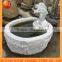 outdoor stone water fountain with animal