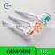 White handle orange head biogenesis dns derma roller for face and scalp treatment