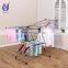 Small hanging clothes coat drying rack with storage