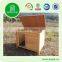Wooden outdoor dog house with patio