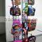 Red metal hanging bag display stand
