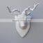 pure white aninal head hanging white deer head with hook on back