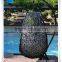 Outdoor patio handwoven black swing hanging chair with white cushions