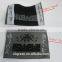 straight cut black background black logo woven label