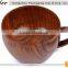 wooden cup of tea with handle