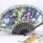 Spanish style plastic folding fan with flower