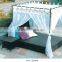 Elegant outdoor wicker daybed with mosquito nets and supports rod