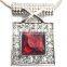 large red crystal surrounded by clear microset crystals necklace and earring