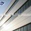 Qingdao prefabricated easy assemble durable works steel prefab warehouse workshop barns shed