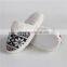 Woman knitted indoor slipper