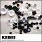 DIY handicraft making decorative white and black buttons