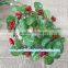 X'mas decorative red fruit flowers garland with green leaves