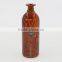 thin tall colorful glass vase with decoration