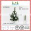 Set of hanging balls and small artificial christmas tree