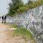 Fence with razor barbed wire to stop refugg/ refugg wall