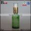 hot selling wholesale 30ml light green empty hair oil glass bottle pump cosmetics screen printing hot stamping free sample