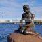 Famous bronze mermaid sculpture by the sea