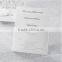 Personalized white laser cut wedding invitations with white ribbons