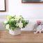Decorative mid century modern Artificial Ivory Rose Floral Arrangement in Square White Ceramic Vase