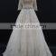 New champagne colored A-line half sleeve straight neckline wedding dress with silver thread lace