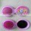 round plastit mirror and hair brush