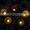 small colorful wax led votive candle with crater
