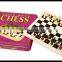 wooden chess set in tin box