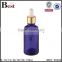 wholesale hot selling 30ml golden aluminum basket dropper essential oil perfume empty blue glass bottle dropper manufacturer