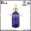 wholesale hot selling 30ml golden aluminum basket dropper essential oil perfume empty blue glass bottle dropper manufacturer