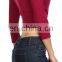 Solid color V-neck 3/4 length sleeve surplice cropped top.