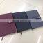 Notebook with button for closure