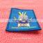 colorful textile woven badge with merrow border