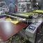 Non woven ultrasonic embossing automatic cutting machine with slitting knives