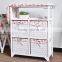 wooden folding ironing board in cabinet