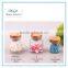 small glass spice jar with wooden lid