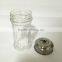 Glass condiment bottles with a metal cap