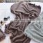 New Design Wholesale 100% Cotton Fringe Solid Pom Pom Blanket Knitted Throw Chunky Warm Travel Blanket