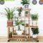 China factory wholesale antique wooden plant stand with wheels