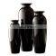 black shiny flower pots