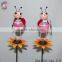 Iron garden stakes of metal beetle standing on kettle sticks for garden decoration