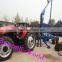 Wood loading trailer with crane