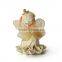 Polyresin smiling sitting angel figurine