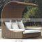 Elegant outdoor wicker daybed with mosquito nets and supports rod
