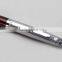 silver red metal ballpoint pen