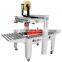 FXJ-5050AS Hualian Hard Tool Mobile Phone Case Packaging Milk Automatic Box Sealing Carton Sealer Machine