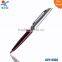 silver red metal ballpoint pen
