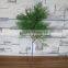 Plastic green cypress branch