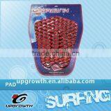 Surfing traction pad