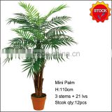 Artificial mini palm tree in stock